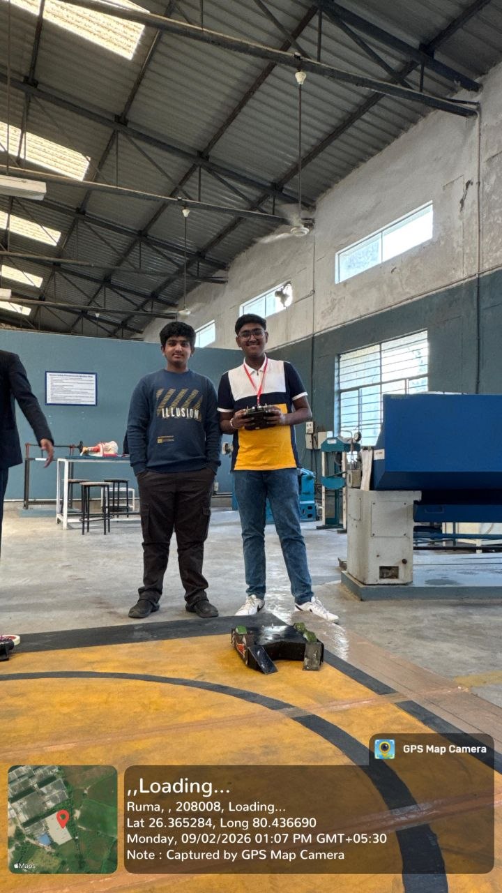 Robotics team beside the arena